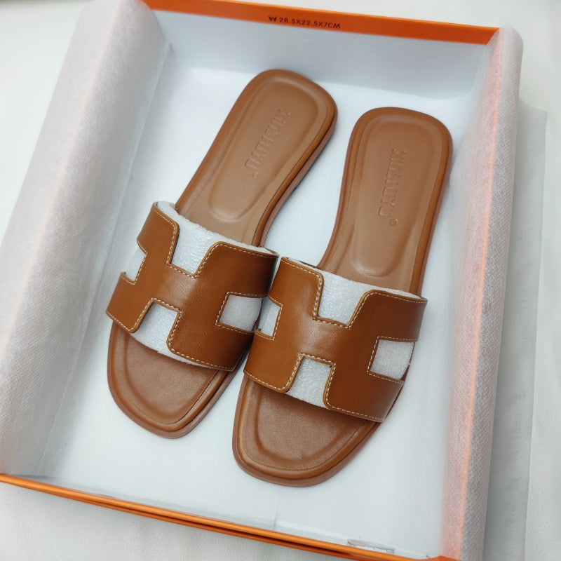 Leren Slippers met Iconisch H-Motief