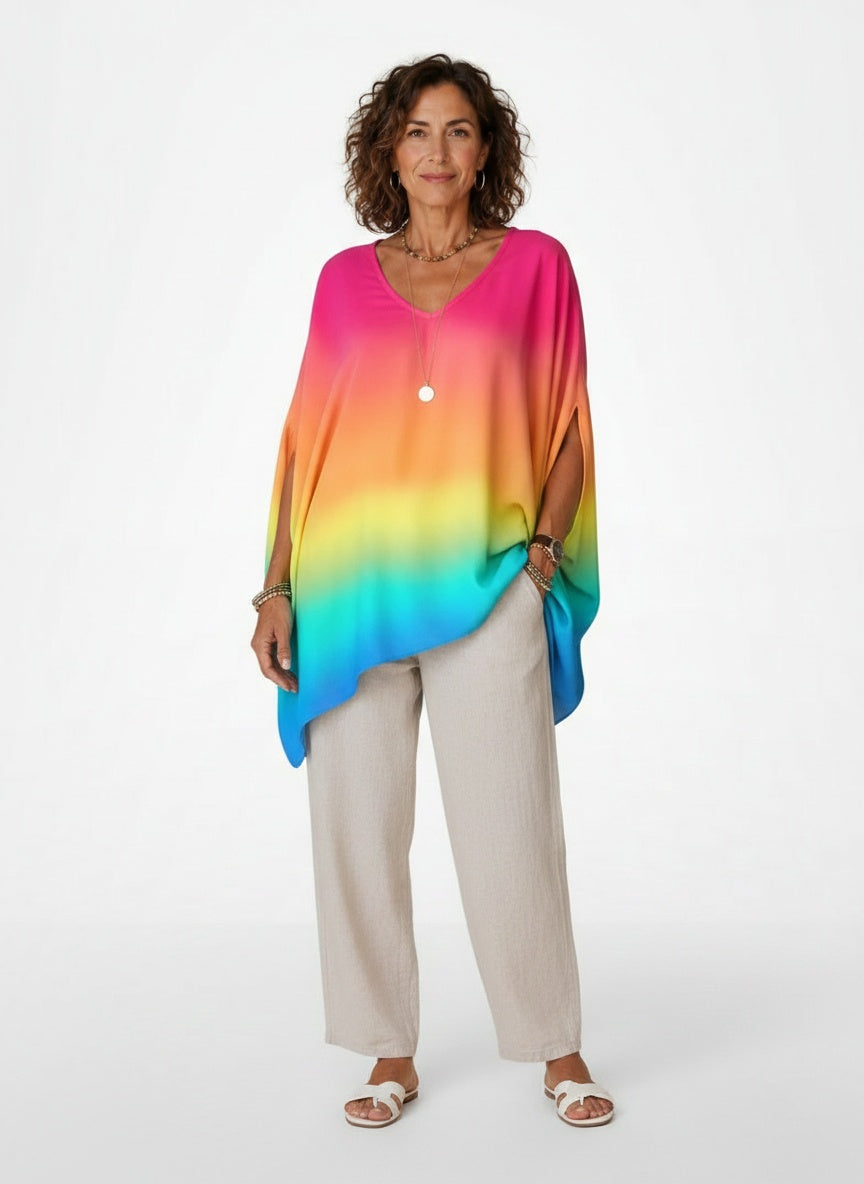 Full body view of the model wearing Asymmetrische Poncho-blouse met V-hals
